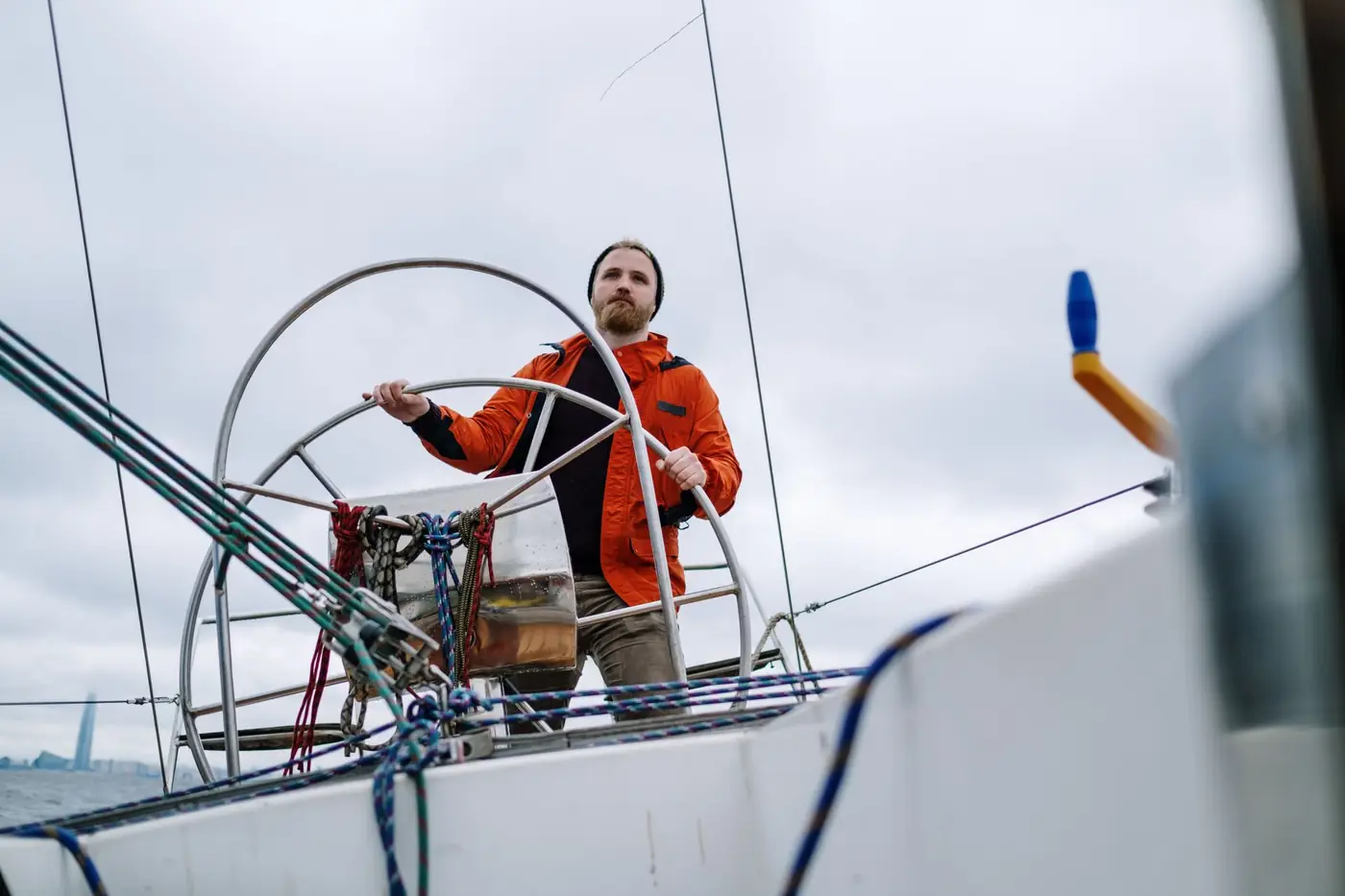 The wheel and cockpit of a modern Beneteau cruising yacht